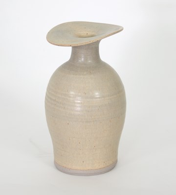 Lot 119 - Russell Collins/A stoneware bottle vase in an...