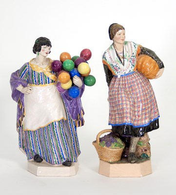 Lot 141 - A Dulwich pottery figure, a lady with a...