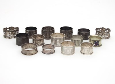 Lot 428 - Fifteen silver and white metal napkin rings,...