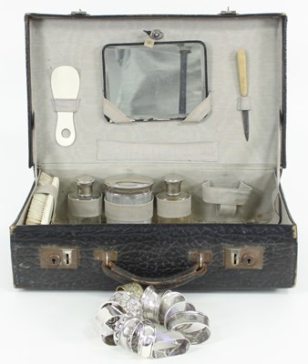 Lot 465 - A tooled leather dressing case with fitted...