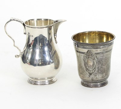 Lot 477 - A silver baluster cream jug, London 1921, with...