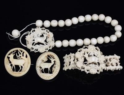 Lot 502 - A selection of bone and ivory brooches etc