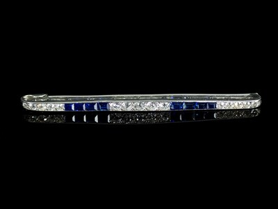 Lot 504 - An Art Deco style diamond and sapphire bar...