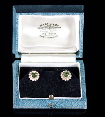 Lot 512 - A pair of peridot and seed pearl cluster ear...