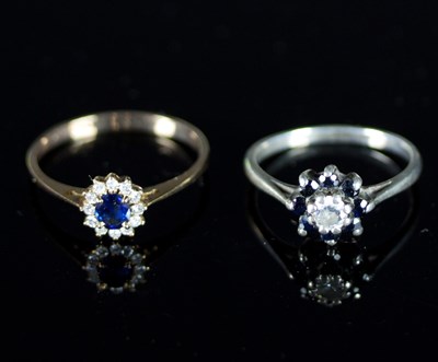 Lot 514 - A sapphire and diamond cluster ring, the oval...