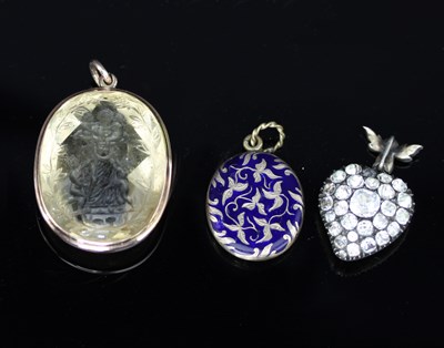 Lot 530 - An intaglio carved pendant, depicting a mother...