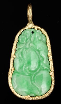 Lot 543 - A Chinese carved jade pendant, depicting a...