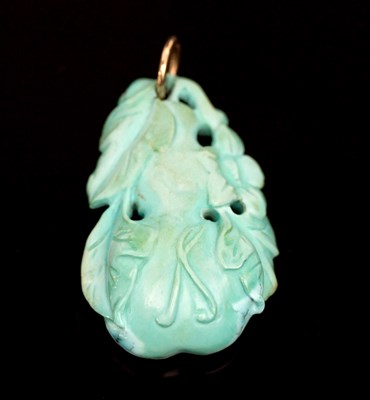 Lot 547 - A Chinese carved turquoise pendant of double...