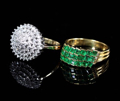 Lot 569 - An emerald and diamond ring of modern design,...