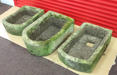 Lot 651 - Three stone troughs, each with one rounded end,...