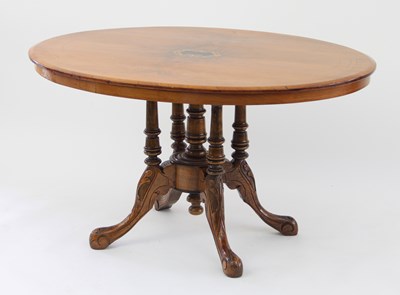 Lot 657 - A Victorian walnut oval loo table, with inlaid...