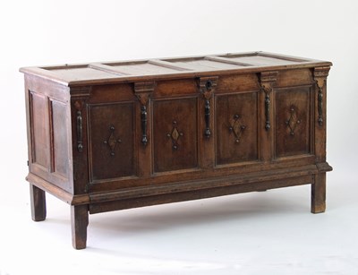 Lot 661 - An oak chest, with quadruple panel hinged...