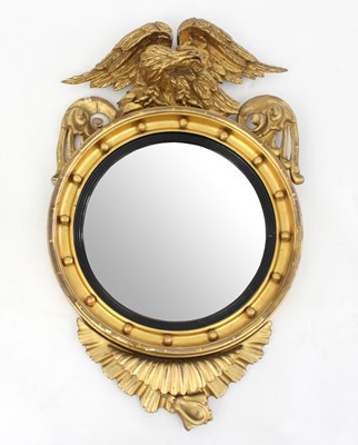 Lot 663 - A Regency giltwood convex wall mirror, with...