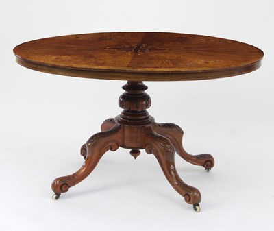 Lot 665 - A Victorian walnut oval loo table, the boxwood...