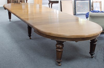 Lot 670 - A Victorian oak extending dining table with...