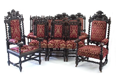 Lot 671 - A matched set of twelve carved oak dining...