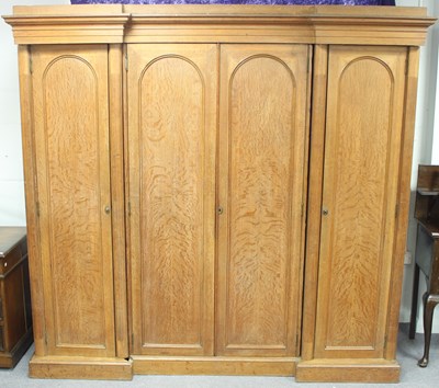 Lot 674 - A Victorian oak breakfront wardrobe, fitted...