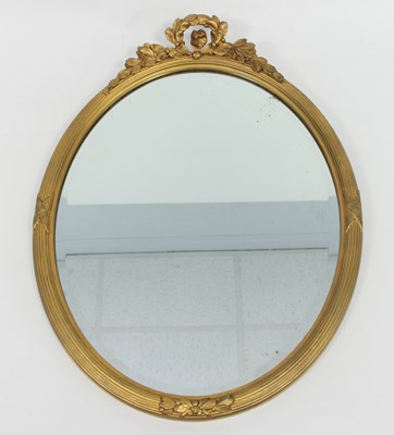 Lot 682 - An Edwardian giltwood wall mirror, of oval...