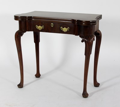 Lot 689 - A George III mahogany fold over card table,...