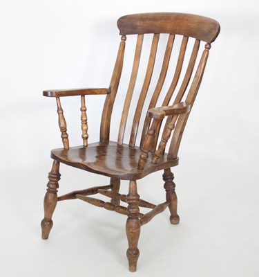 Lot 694 - A Victorian beech and elm stick back armchair,...