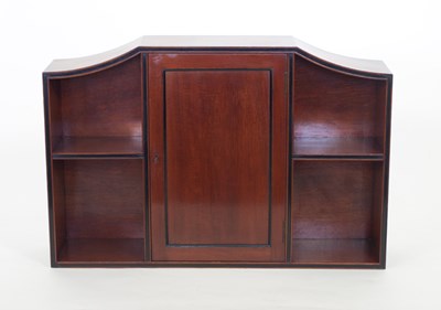 Lot 695 - A set of mahogany wall shelves, the central...