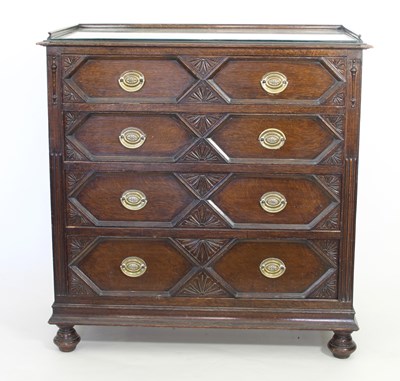 Lot 703 - A Jacobean style oak moulded front chest of...