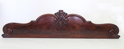 Lot 704 - A Victorian mahogany carved bed end, 216cm wide