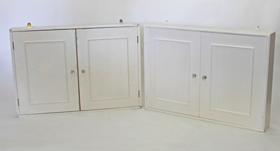 Lot 707 - A pair of painted wall cabinets with panelled...