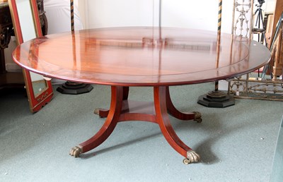 Lot 726 - A 20th Century mahogany circular dining table...