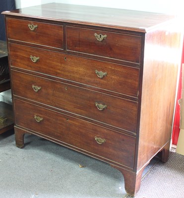 Lot 733 - A George III mahogany chest, fitted three long...