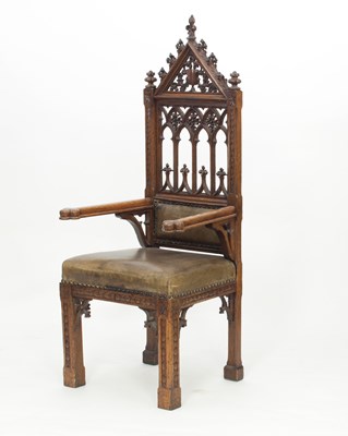 Lot 745 - A Victorian gothic grained oak armchair, the...