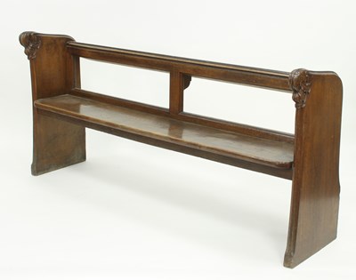 Lot 777 - A Victorian oak pew with carved ends, from...