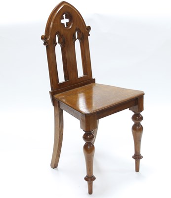 Lot 779 - A Victorian Gothic revival oak hall chair, the...