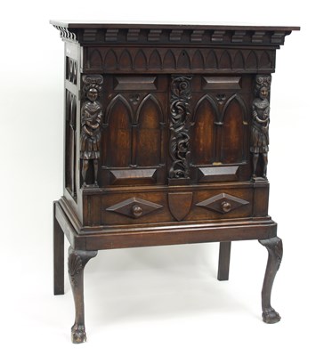 Lot 783 - An oak cupboard enclosed by a pair of gothic...