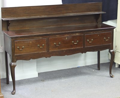 Lot 790 - An oak dresser base of three drawers, with...