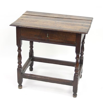 Lot 792 - An 18th Century oak table, the top with...