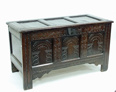 Lot 801 - An 18th Century oak chest with later carved...