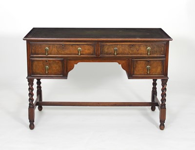 Lot 807 - A walnut writing desk, with a green leather...