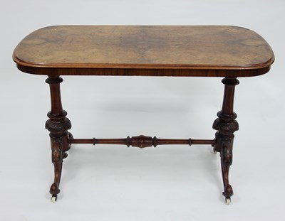 Lot 815 - A Victorian figured oval walnut table with...