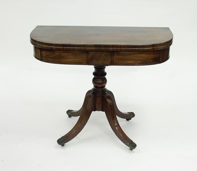 Lot 820 - A late Georgian mahogany D-shaped tea table on...