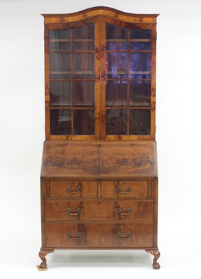 Lot 837 - A reproduction bureau bookcase, the arched...