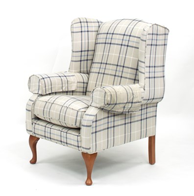 Lot 838 - A modern upholstered wing armchair