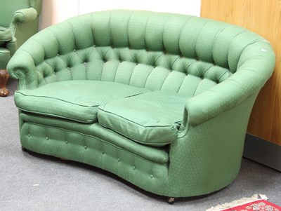 Lot 849 - A button back upholstered two-seat sofa with...