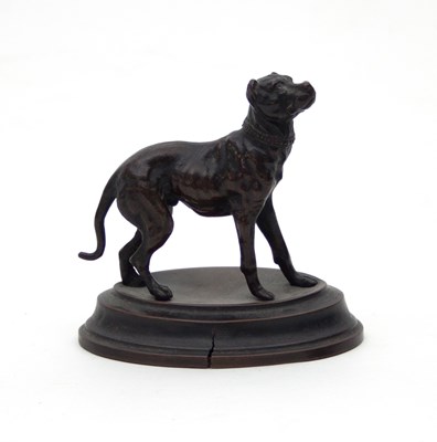 Lot 861 - A small bronze model of a dog, mounted on an...