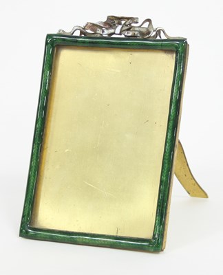 Lot 868 - An enamelled easel back photograph frame,...