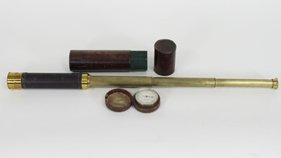 Lot 886 - A three-draw brass telescope with leather case...