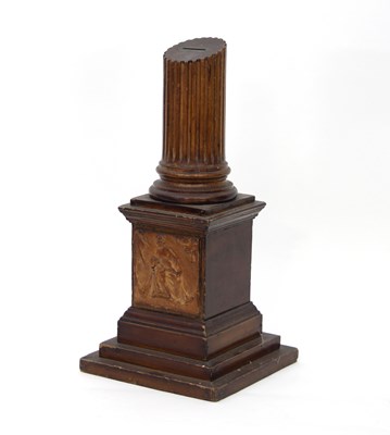 Lot 891 - A wooden money box in the form of a ruined...