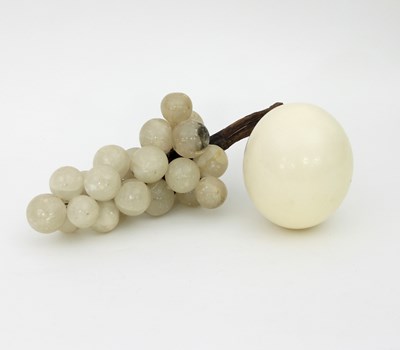 Lot 906 - An ostrich egg and a bunch of alabaster grapes