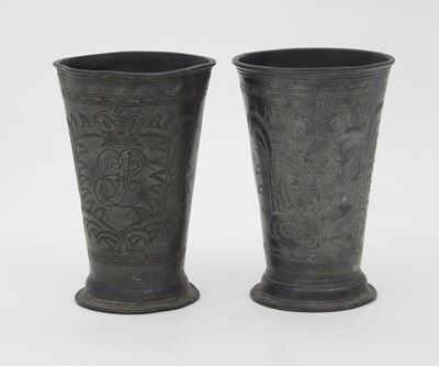 Lot 917 - A pair of Continental pewter beakers engraved...