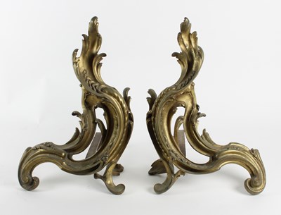 Lot 918 - A pair of gilt bronze chenets of rococo form,...